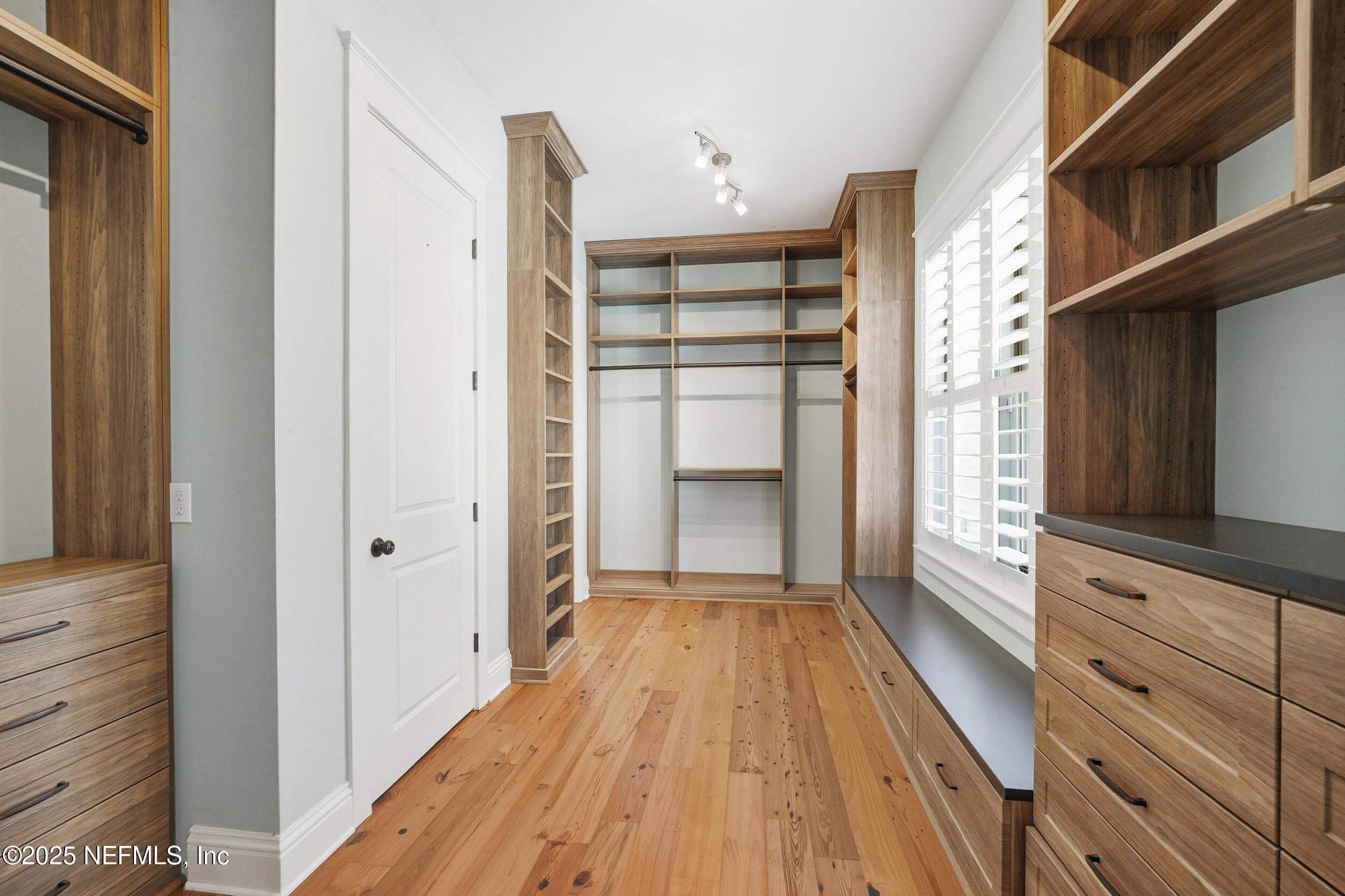 4745 Palm Valley Road Ponte Vedra Beach, FL 32082 - Photo 40 of 104 a view of walk in closet with empty racks