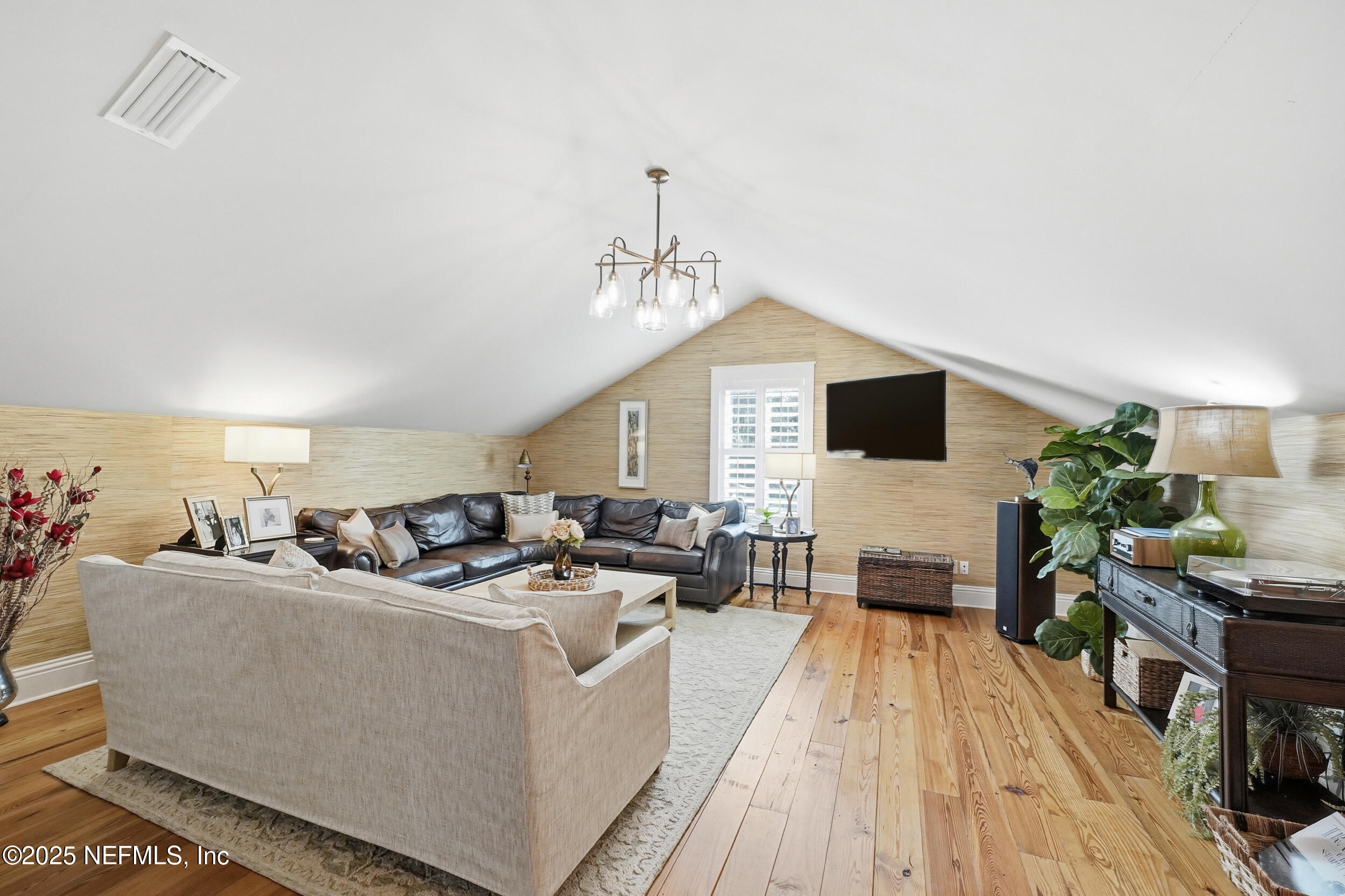 4745 Palm Valley Road Ponte Vedra Beach, FL 32082 - Photo 50 of 104 a living room with furniture and a flat screen tv