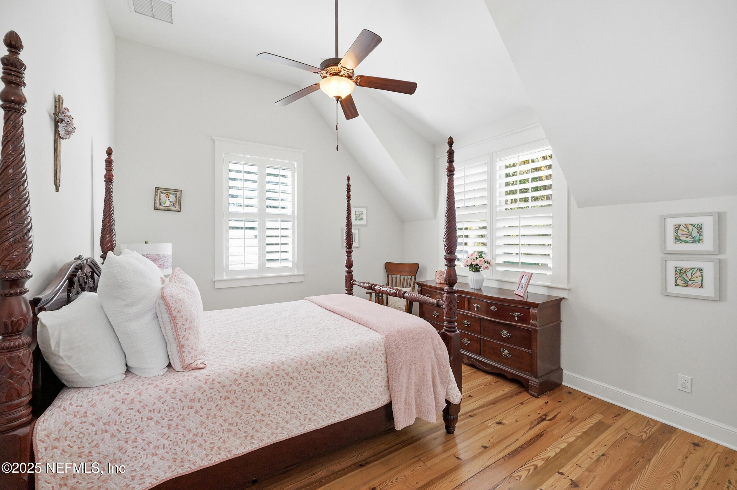 4745 Palm Valley Road Ponte Vedra Beach, FL 32082 - Photo 60 of 104 a bedroom with a bed and a chandelier