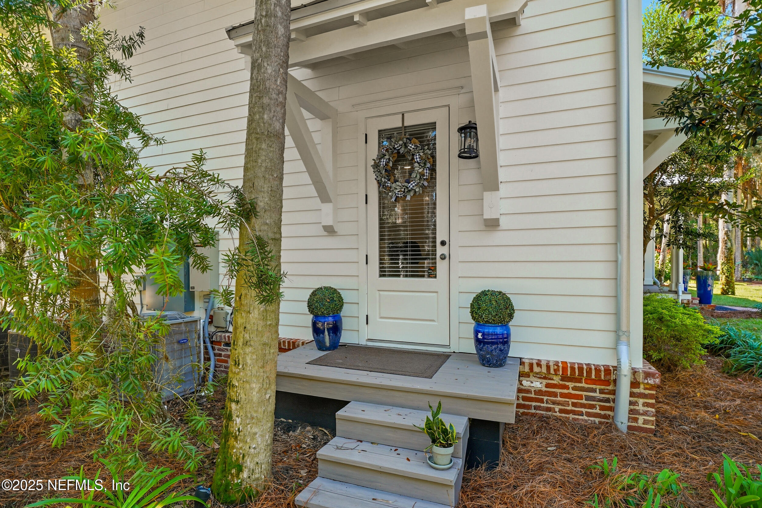 4745 Palm Valley Road Ponte Vedra Beach, FL 32082 - Photo 89 of 104 a view of a bench sitting in back yard of the house