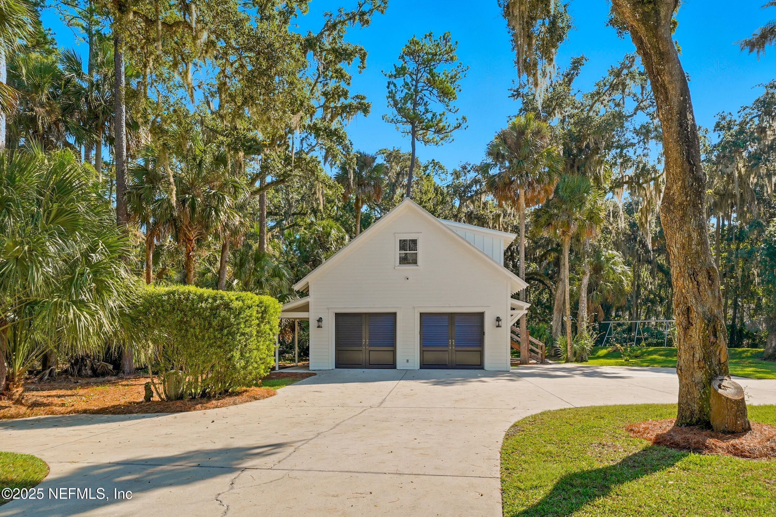 4745 Palm Valley Road Ponte Vedra Beach, FL 32082 - Photo 90 of 104 a front view of a house with a garden