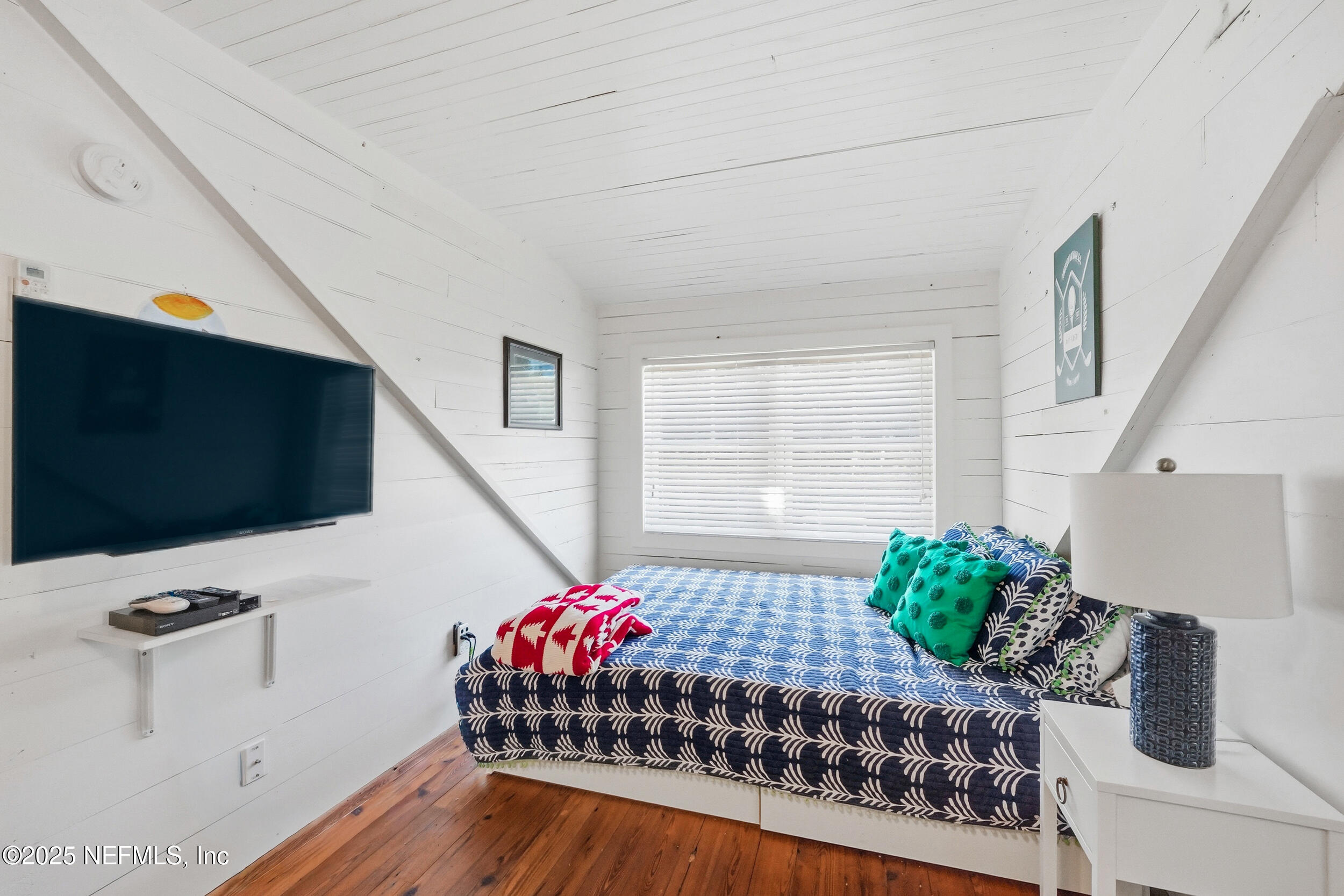 4745 Palm Valley Road Ponte Vedra Beach, FL 32082 - Photo 96 of 104 a living room with furniture and a flat screen tv