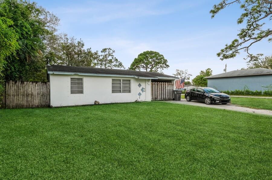 5718 Dryden Road West Palm Beach, FL 33415 - Photo 3 of 10 5718 Druden Rd Exterior Front 2