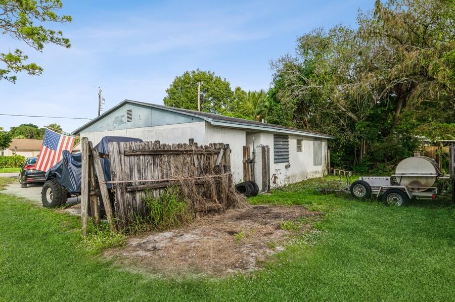 5718 Dryden Road West Palm Beach, FL 33415 - Photo 9 of 10 5718 Dryden Rd Exterior Rear