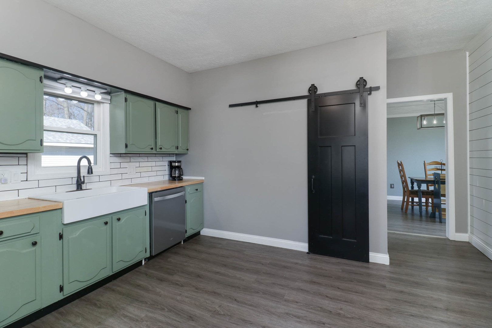 207 Field Street Secor, IL 61771 - Photo 11 of 30 a view of a kitchen with a sink cabinet and a refrigerator