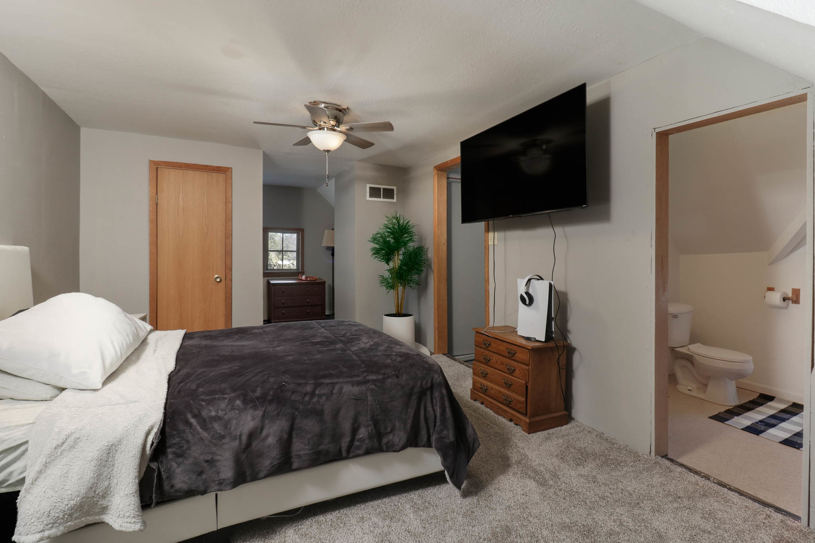 207 Field Street Secor, IL 61771 - Photo 16 of 30 a bedroom with a bed and a flat screen tv