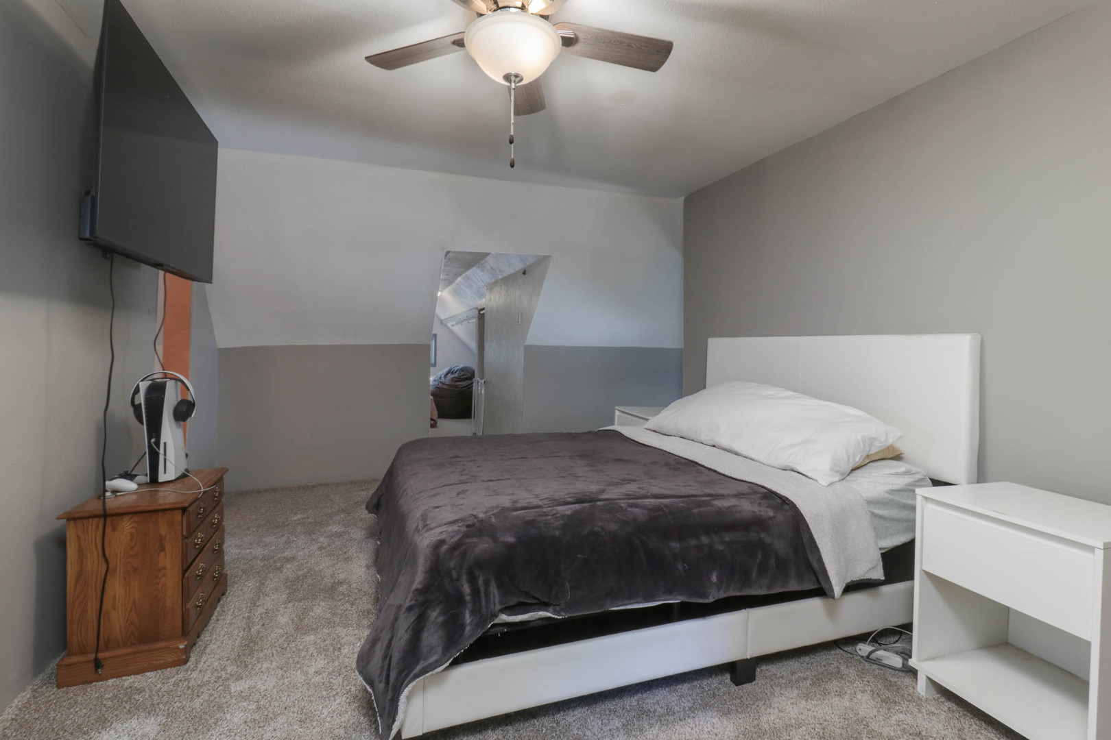 207 Field Street Secor, IL 61771 - Photo 17 of 30 a bedroom with a bed and a flat screen tv