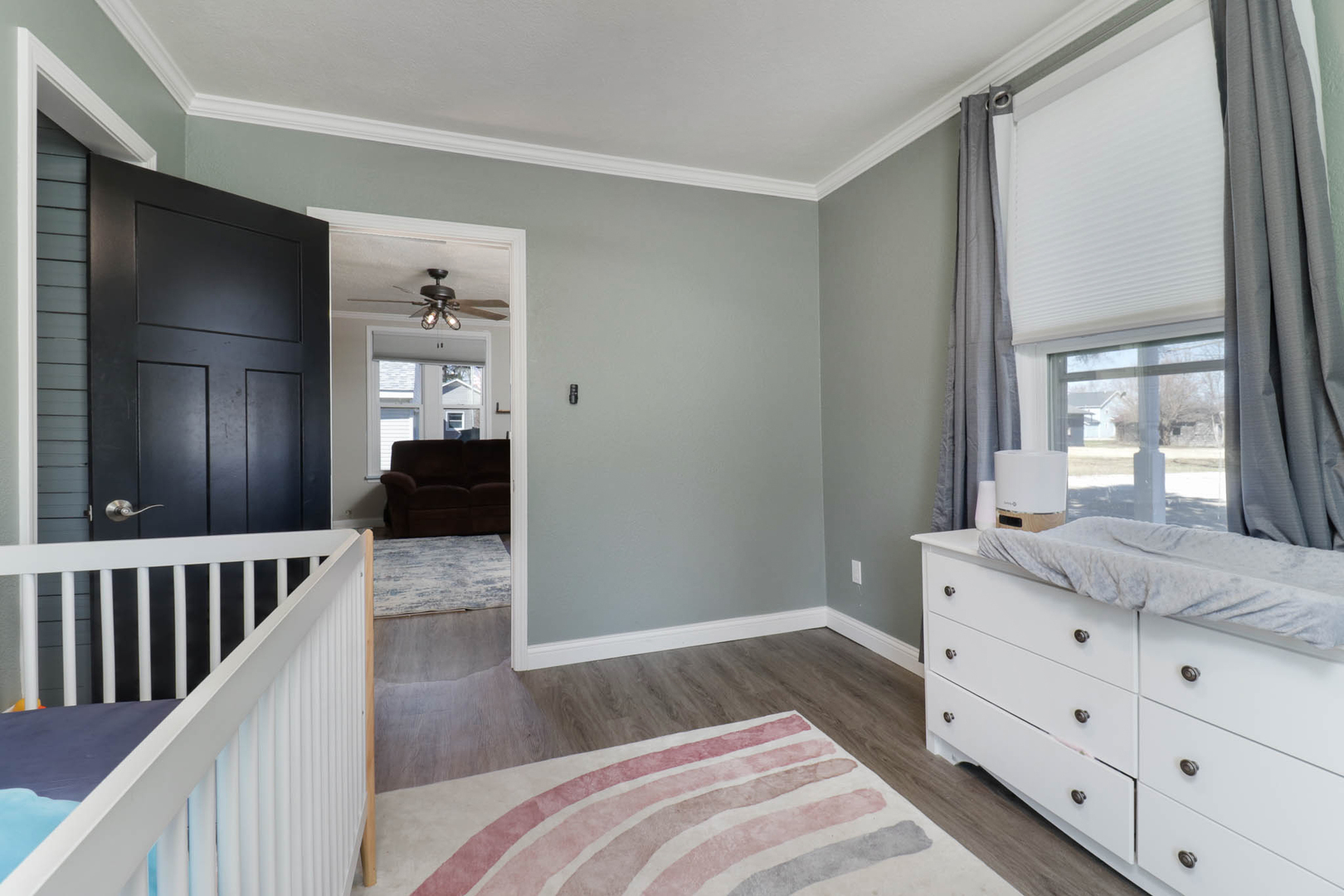 207 Field Street Secor, IL 61771 - Photo 21 of 30 a bedroom with a bed and a dresser