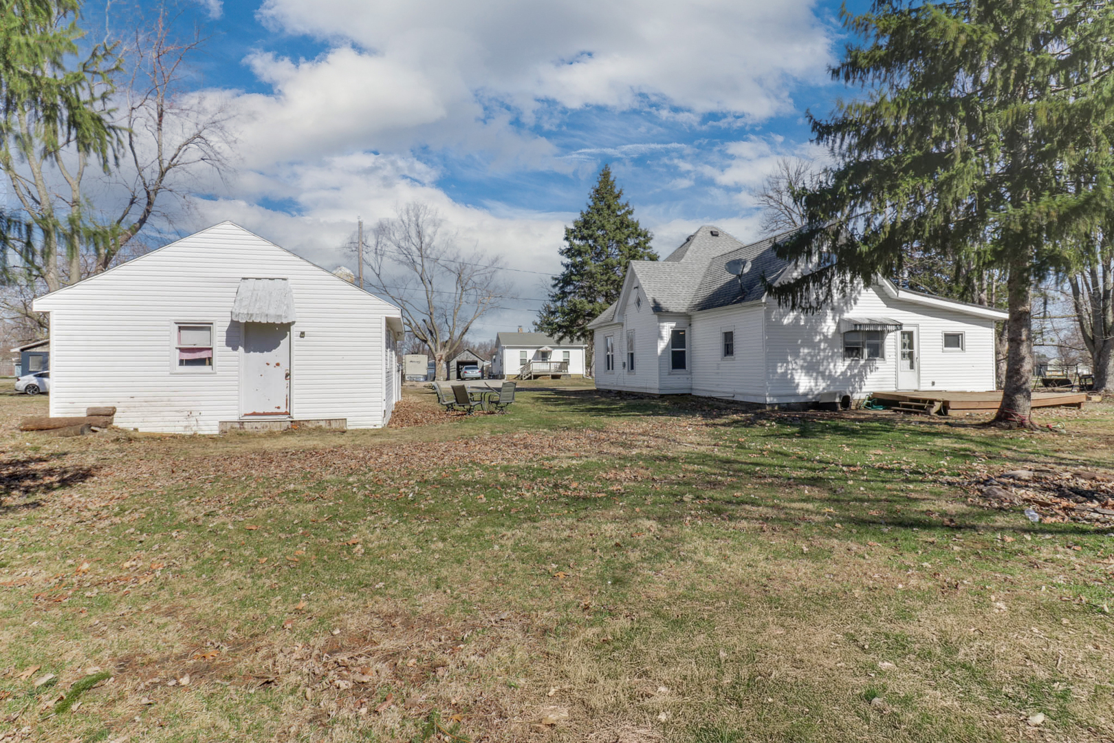 207 Field Street Secor, IL 61771 - Photo 25 of 30 a view of a white house with a yard