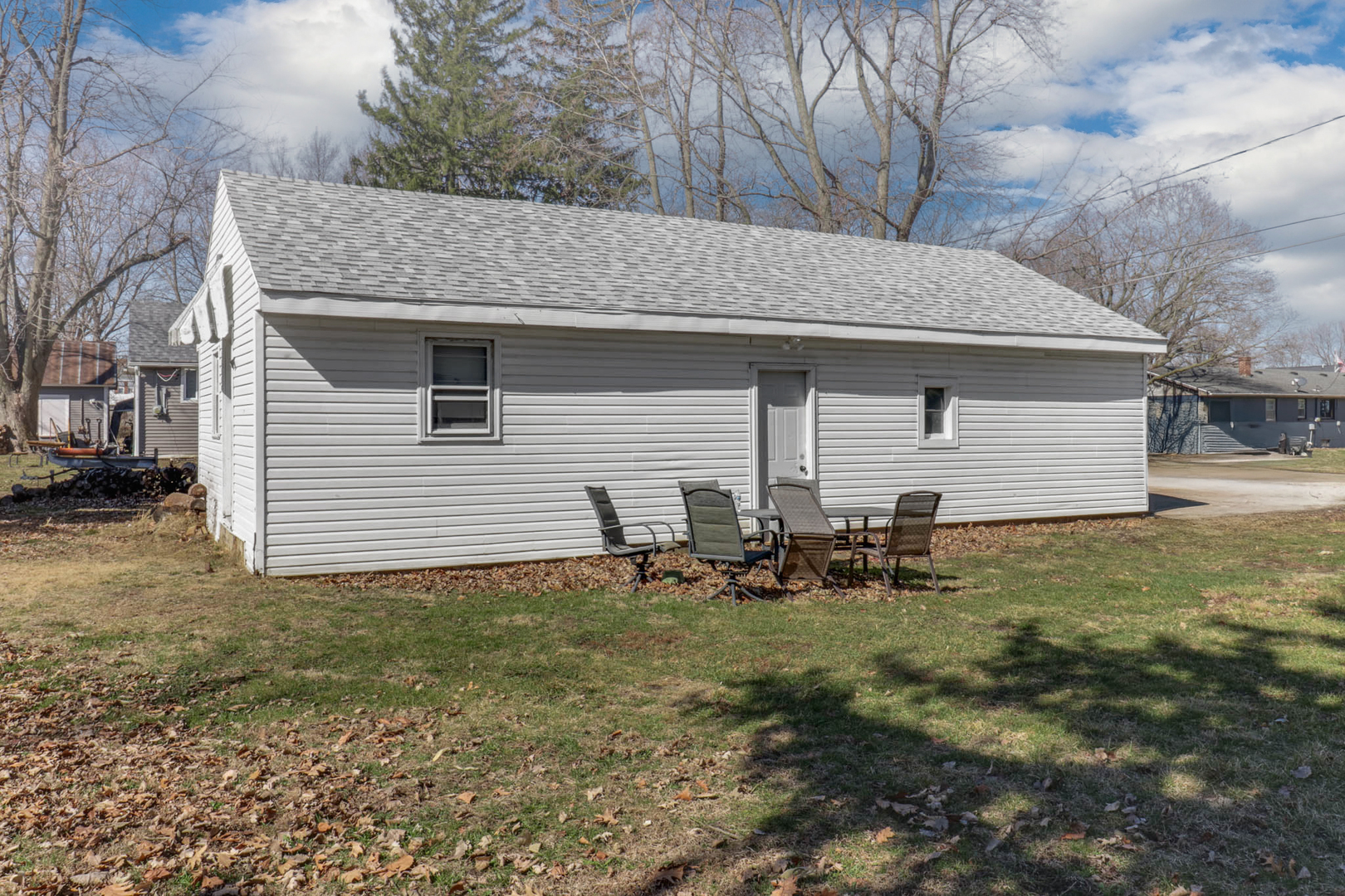 207 Field Street Secor, IL 61771 - Photo 29 of 30 a backyard of a house with table and chairs