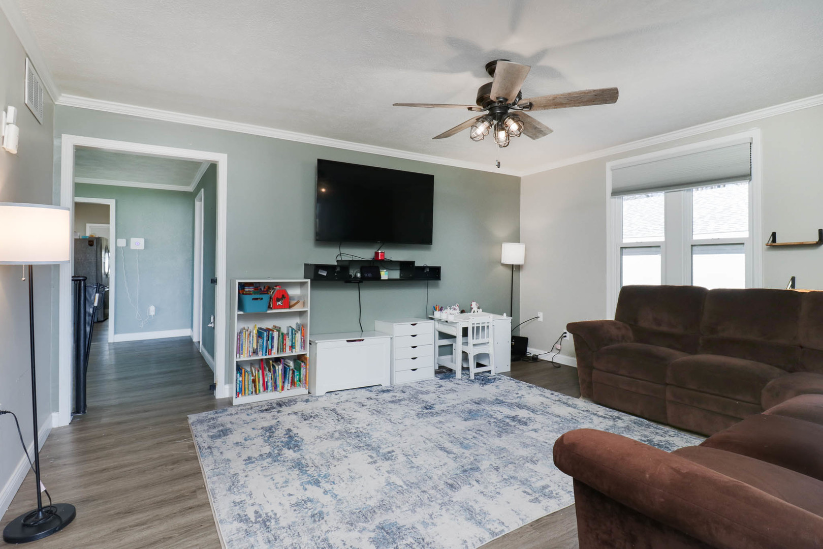 207 Field Street Secor, IL 61771 - Photo 4 of 30 a living room with furniture and a flat screen tv