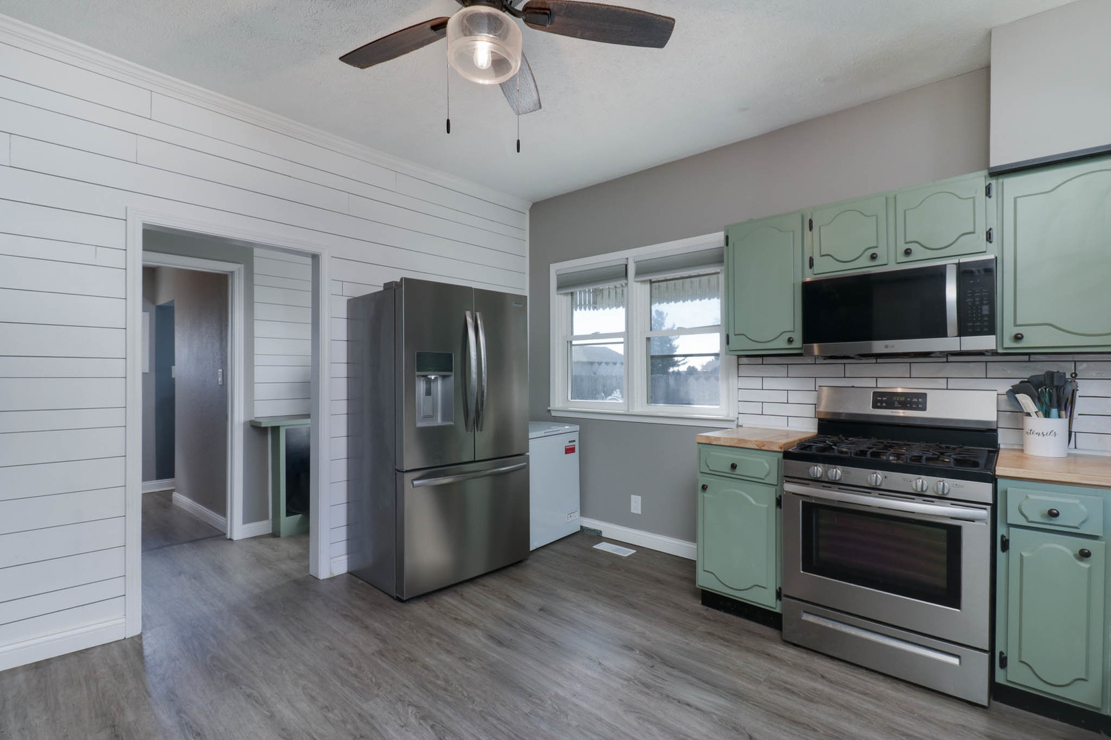 207 Field Street Secor, IL 61771 - Photo 10 of 30 a kitchen with stainless steel appliances a stove microwave and a refrigerator