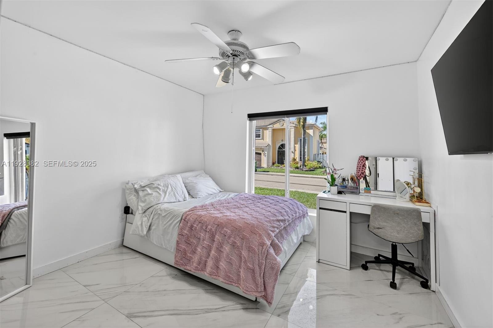 720 Rock Hill Avenue Davie, FL 33325 - Photo 14 of 27 a bedroom with a bed and a desk