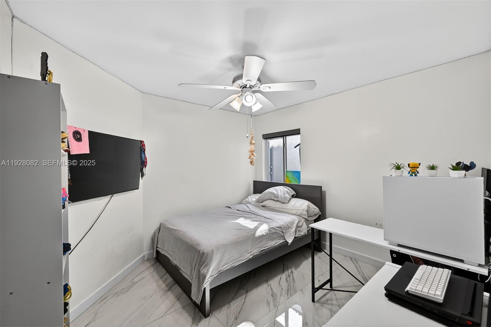 720 Rock Hill Avenue Davie, FL 33325 - Photo 16 of 27 a bedroom with a bed and a window