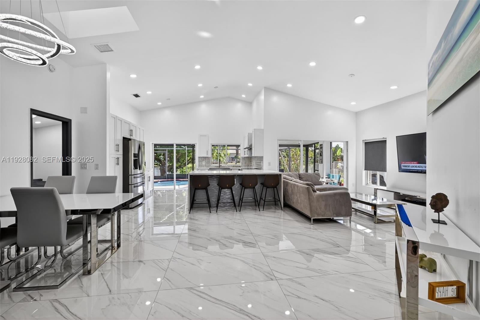 720 Rock Hill Avenue Davie, FL 33325 - Photo 2 of 27 a living room with furniture and a flat screen tv