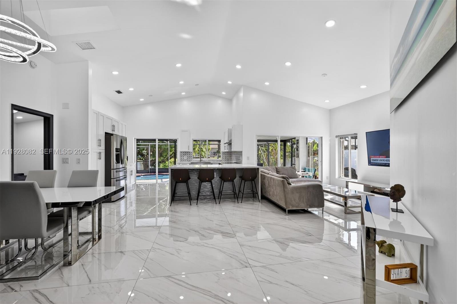 720 Rock Hill Avenue Davie, FL 33325 - Photo 4 of 27 a living room with furniture and a table