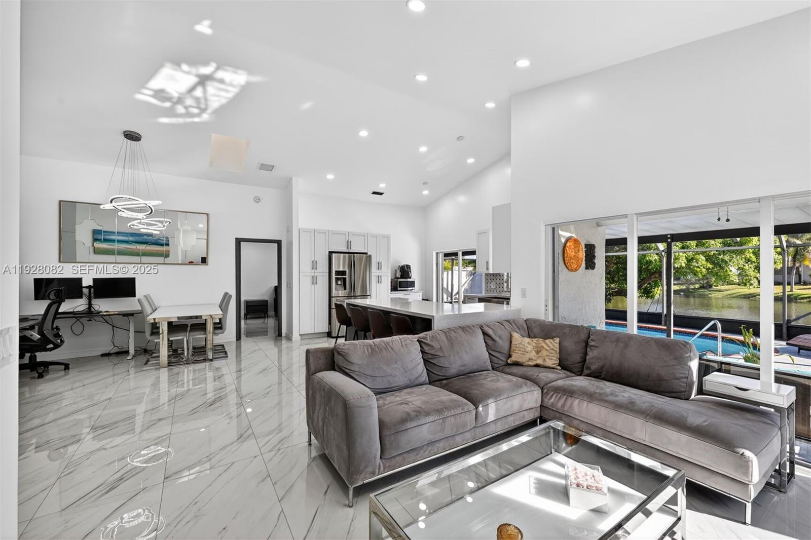 720 Rock Hill Avenue Davie, FL 33325 - Photo 5 of 27 a living room with furniture and a large window