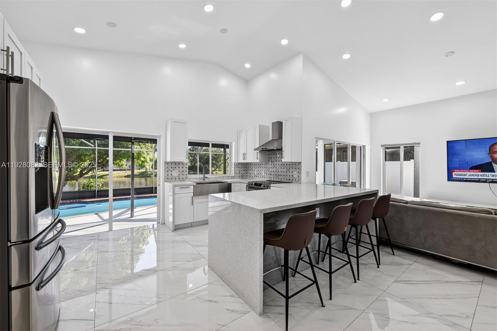 720 Rock Hill Avenue Davie, FL 33325 - Photo 7 of 27 a kitchen with a table and chairs in it