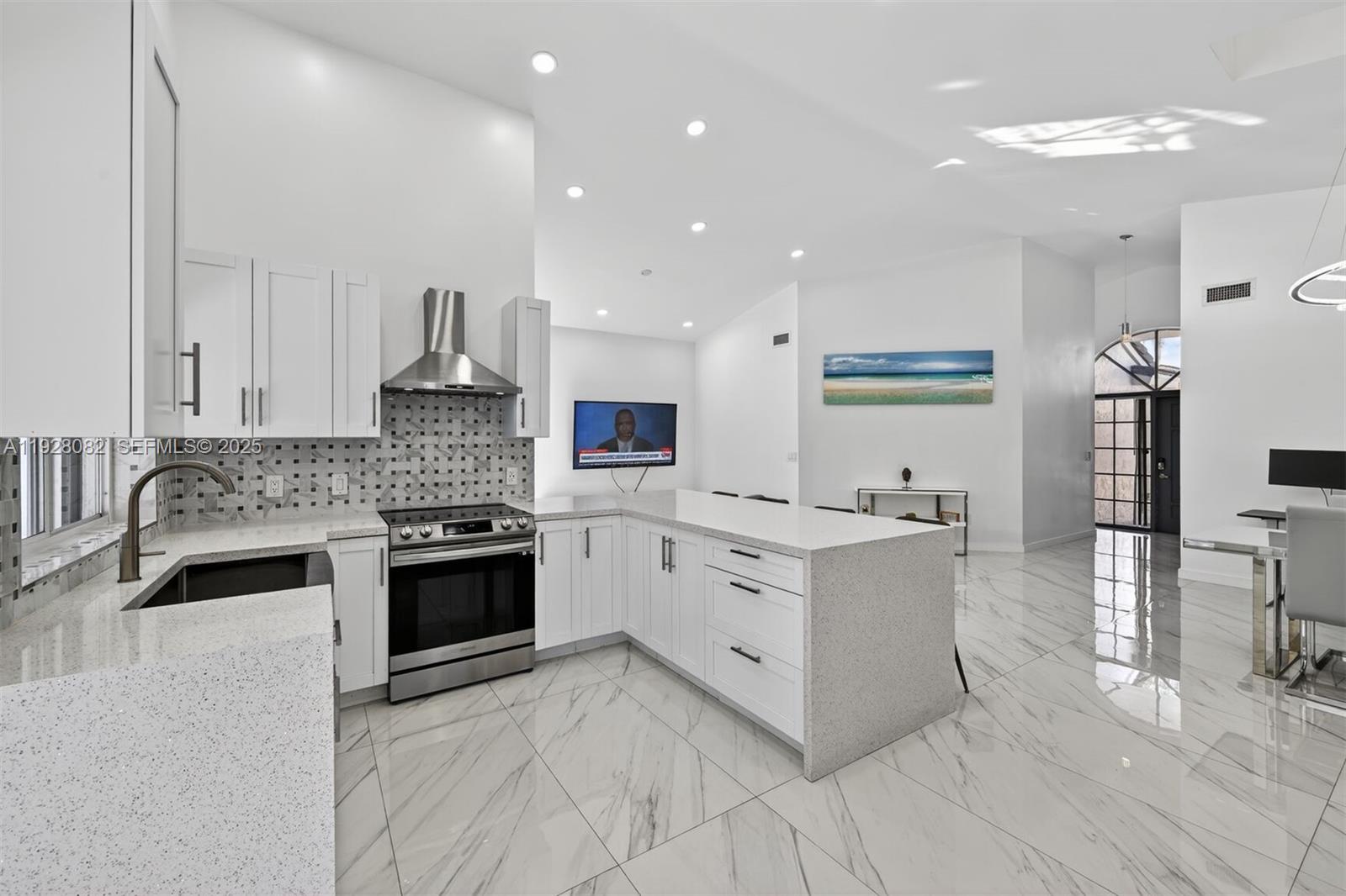 720 Rock Hill Avenue Davie, FL 33325 - Photo 8 of 27 a kitchen with white cabinets and appliances