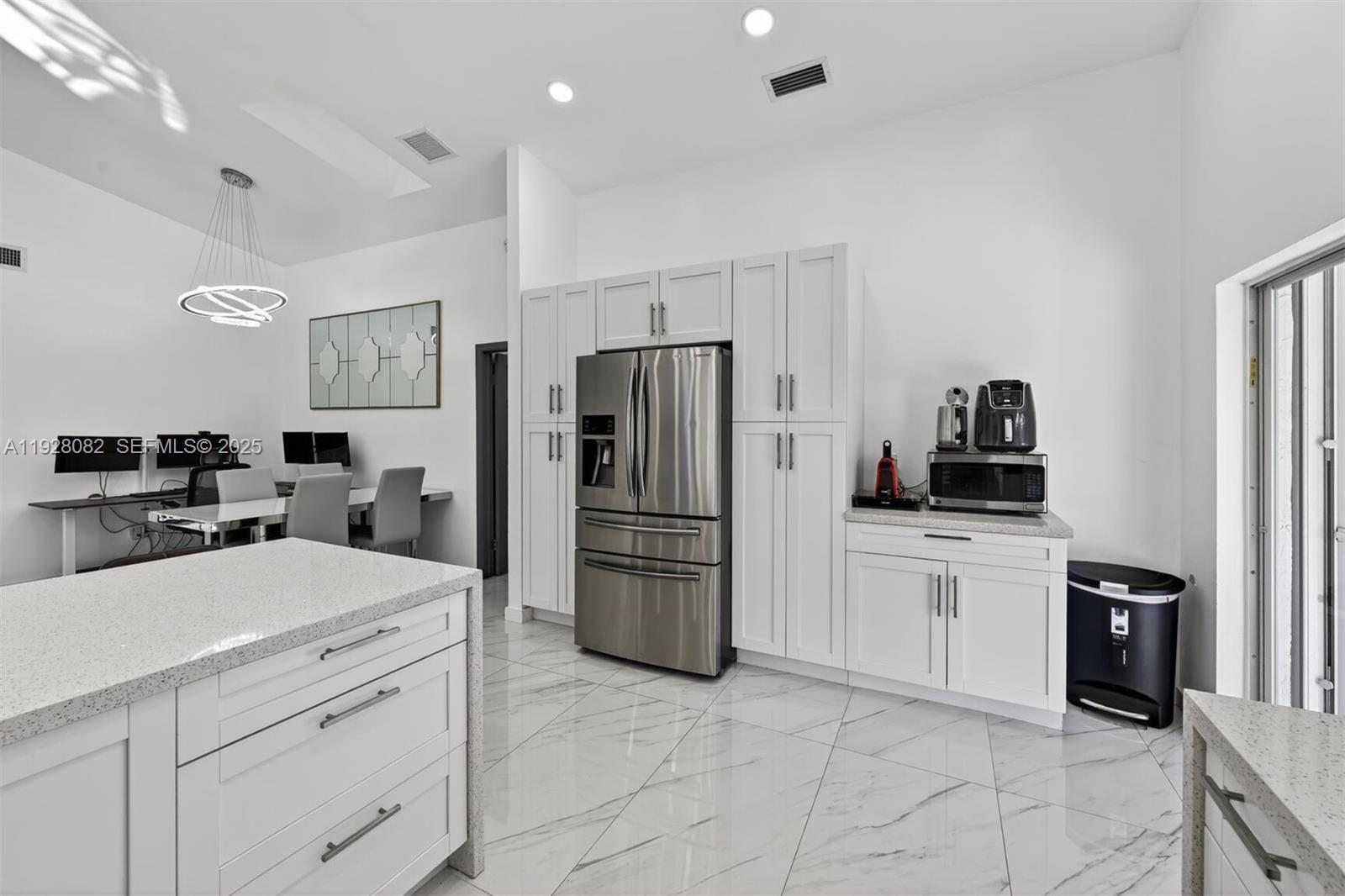 720 Rock Hill Avenue Davie, FL 33325 - Photo 9 of 27 a kitchen with a refrigerator and a stove top oven