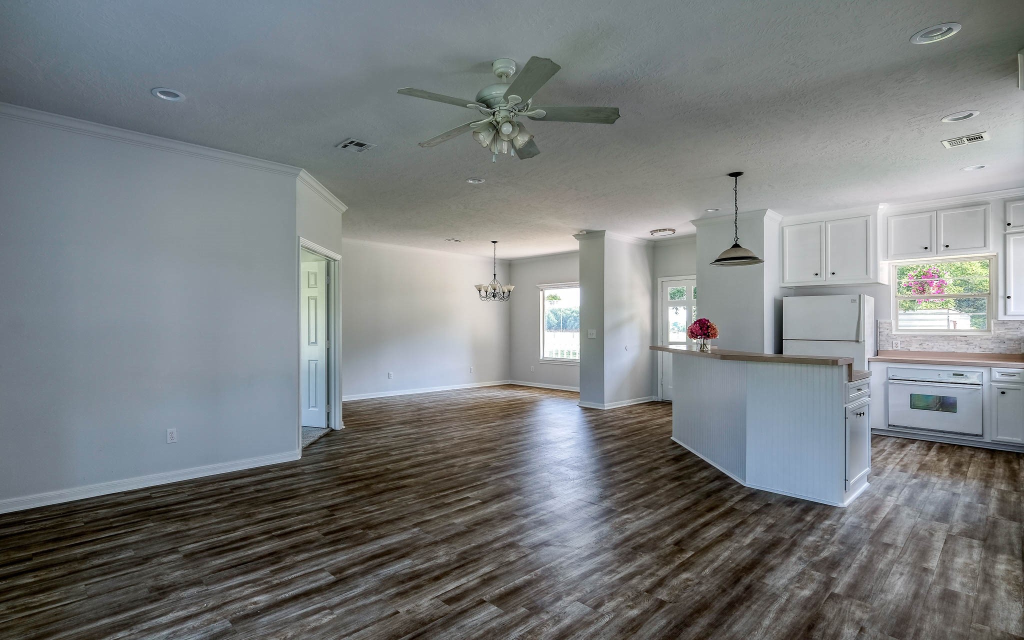 20515 Kickapoo Road Waller, TX 77484 - Photo 39 of 50 a view of kitchen and hall with wooden floor