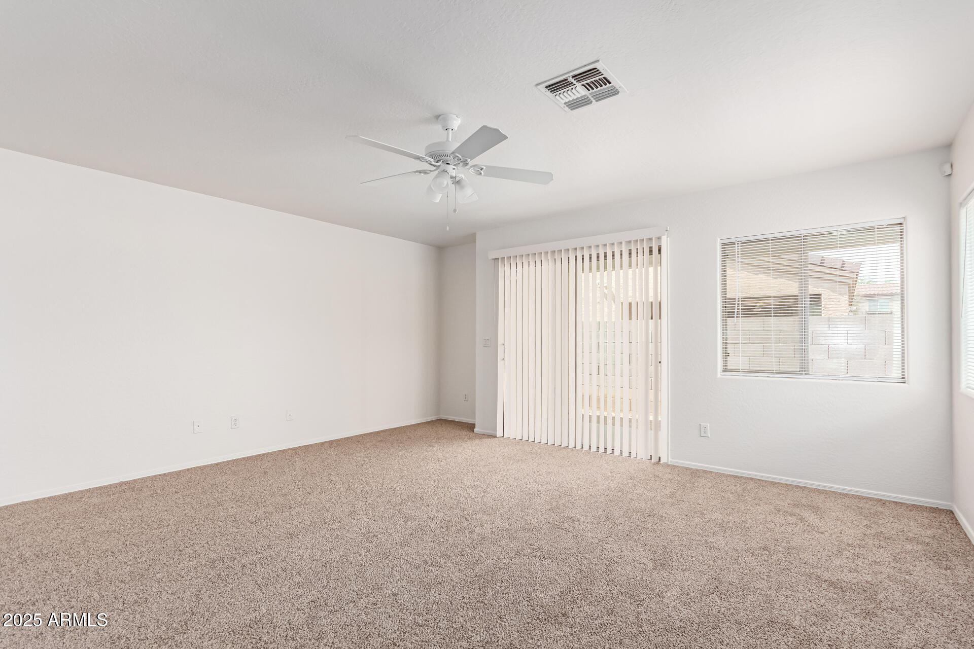 3728 West Fremont Rd. Phoenix, AZ 85041 - Photo 4 of 27 a view of an empty room with a window