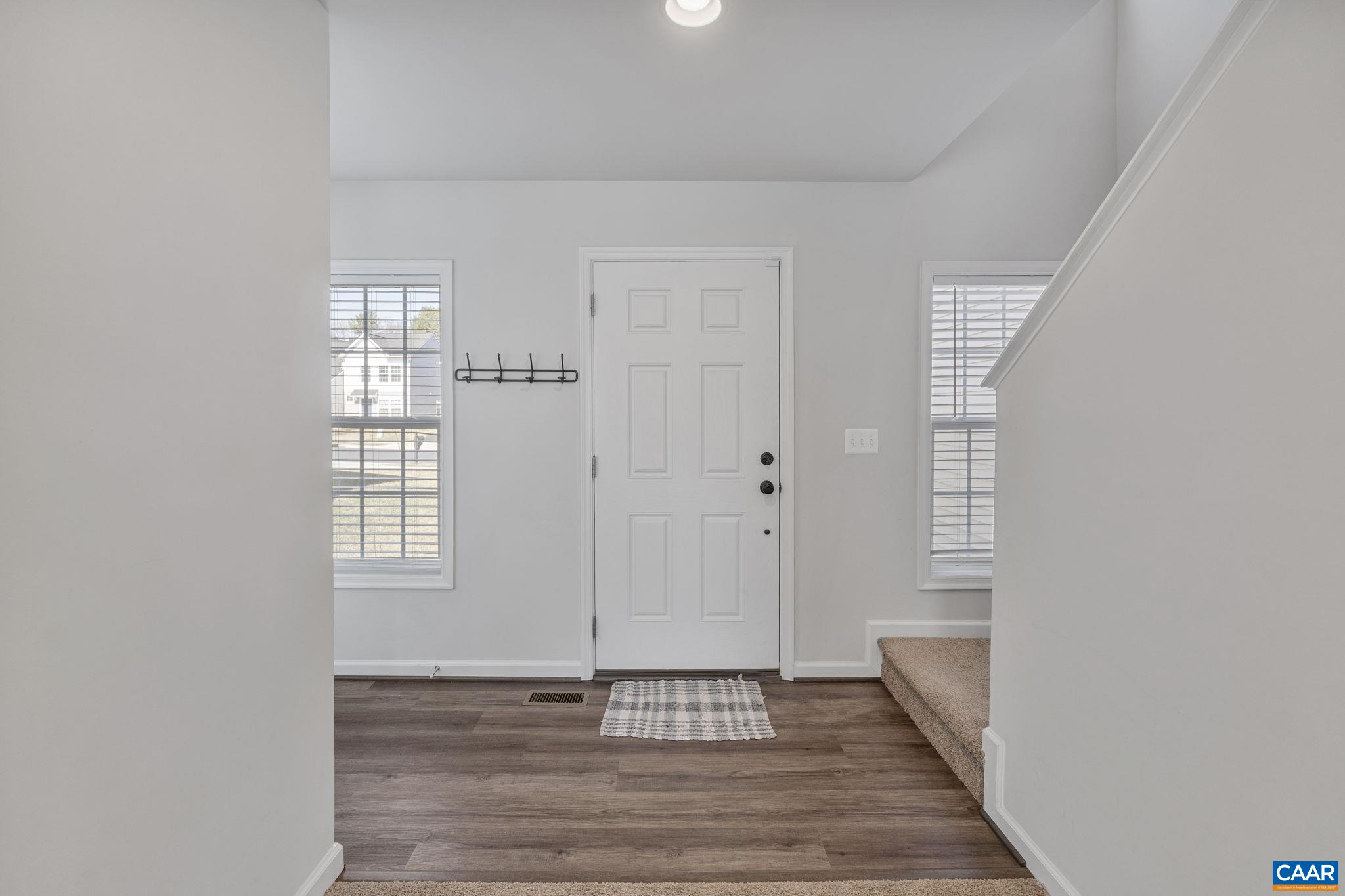 124 Shady Court Waynesboro, VA 22980 - Photo 3 of 32 a view of an empty room with wooden floor and a window