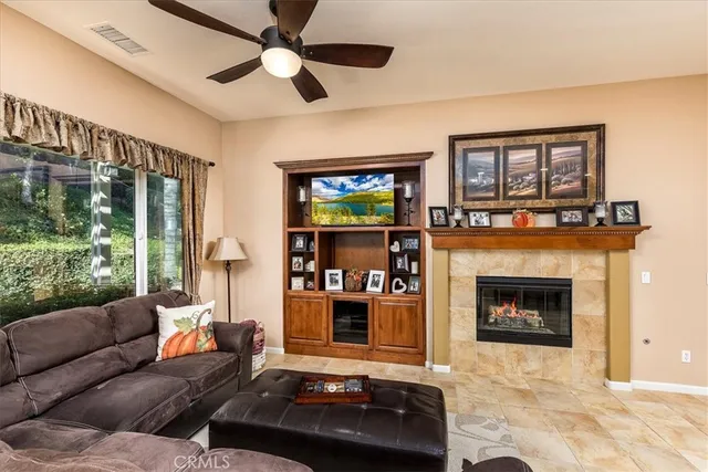a bedroom with a bed a dresser and a window