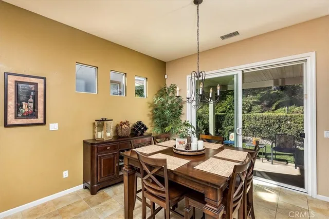 a bathroom with a granite countertop shower and a sink