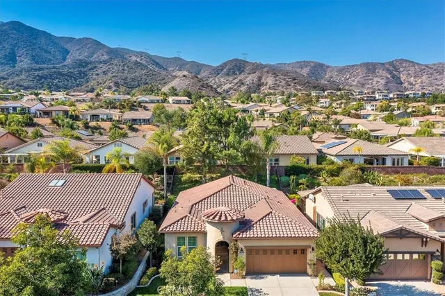 an aerial view of residential houses and outdoor space