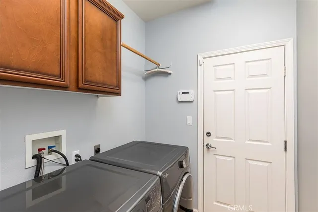 a building outdoor space with patio furniture and garden