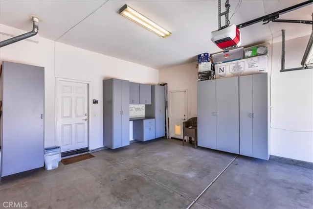 a view of a porch with chairs and backyard