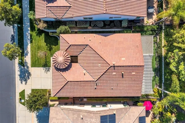 a view of a porch with furniture and garden