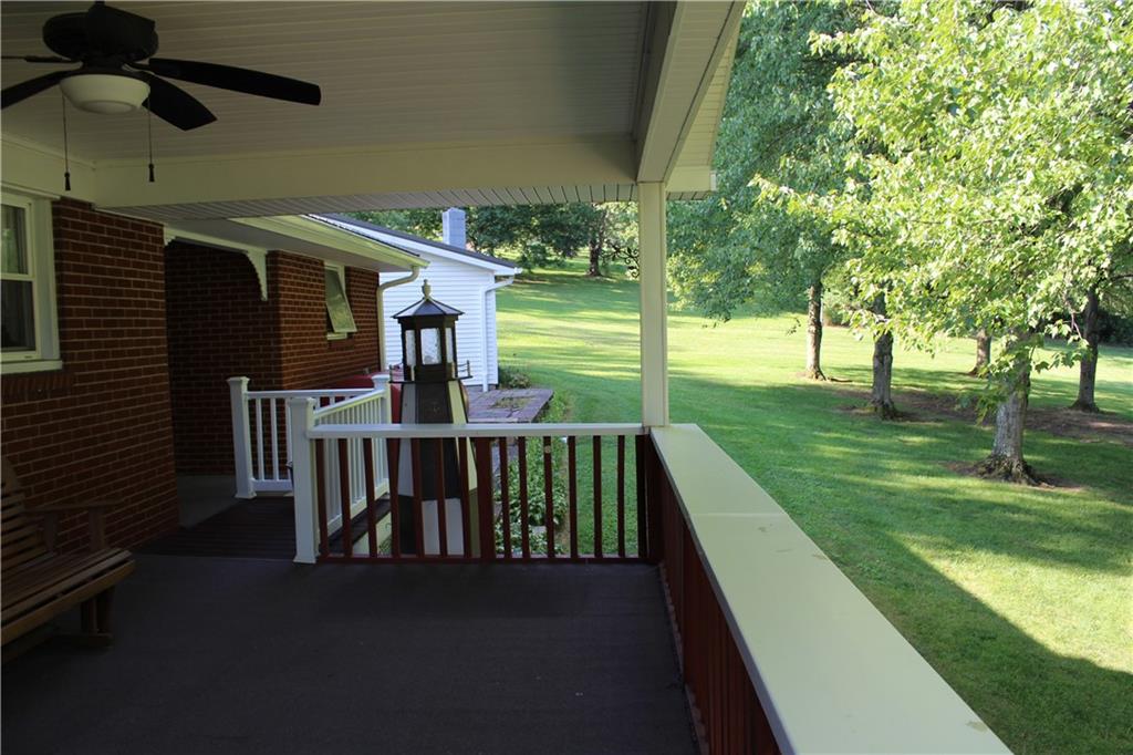 928 Old Ridge Road Avella, PA 15312 - Photo 13 of 49 a view of a patio with a table chairs and a backyard