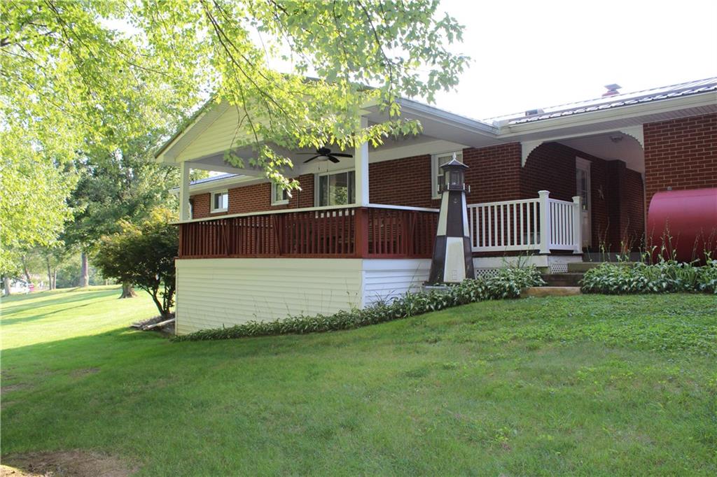 928 Old Ridge Road Avella, PA 15312 - Photo 15 of 49 a front view of a house with garden