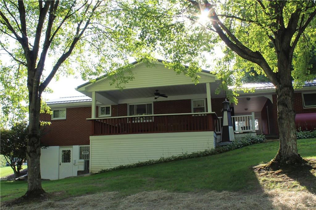 928 Old Ridge Road Avella, PA 15312 - Photo 17 of 49 a front view of a house with a yard