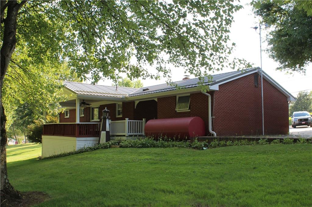 928 Old Ridge Road Avella, PA 15312 - Photo 19 of 49 a front view of house with yard and outdoor seating
