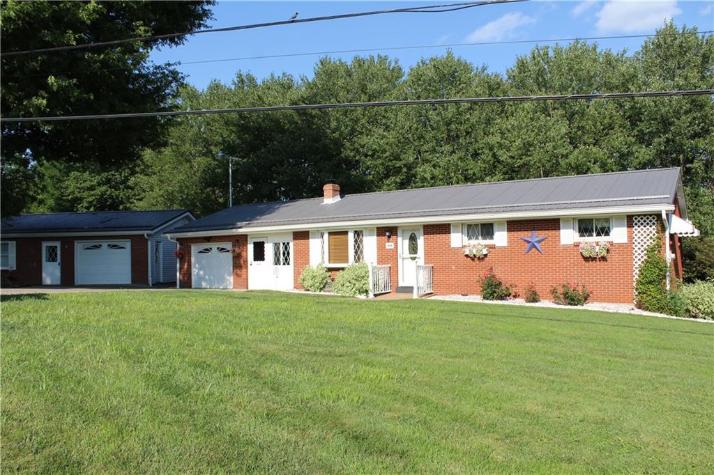 928 Old Ridge Road Avella, PA 15312 - Photo 3 of 49 a view of a house with a yard