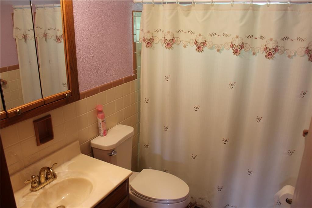 928 Old Ridge Road Avella, PA 15312 - Photo 32 of 49 a white toilet sitting next to a bathroom sink