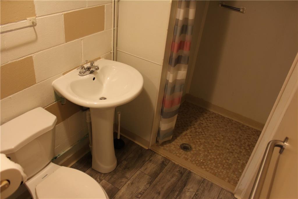 928 Old Ridge Road Avella, PA 15312 - Photo 37 of 49 a bathroom with a sink toilet and shower