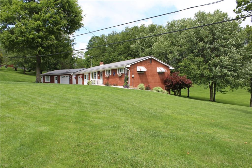 928 Old Ridge Road Avella, PA 15312 - Photo 4 of 49 a view of a house with a big yard and large trees