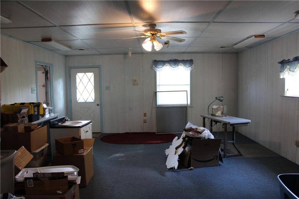 928 Old Ridge Road Avella, PA 15312 - Photo 44 of 49 a living room with furniture a window and gym equipment