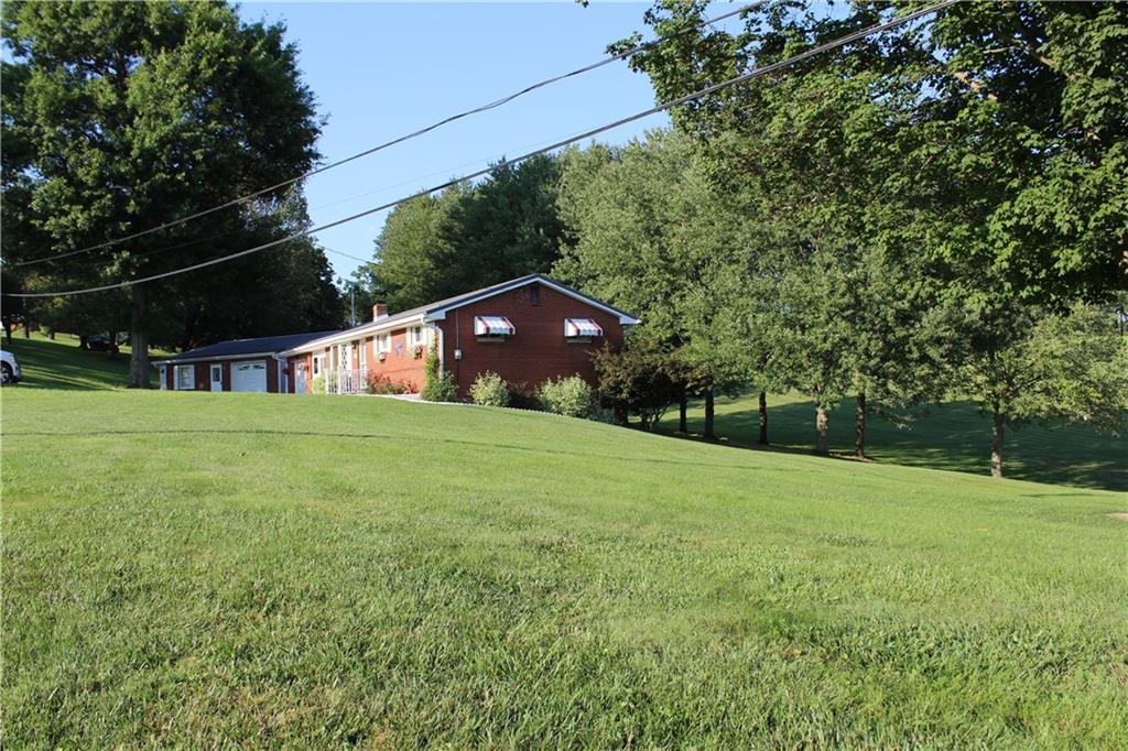 928 Old Ridge Road Avella, PA 15312 - Photo 6 of 49 a view of a field of grass and trees