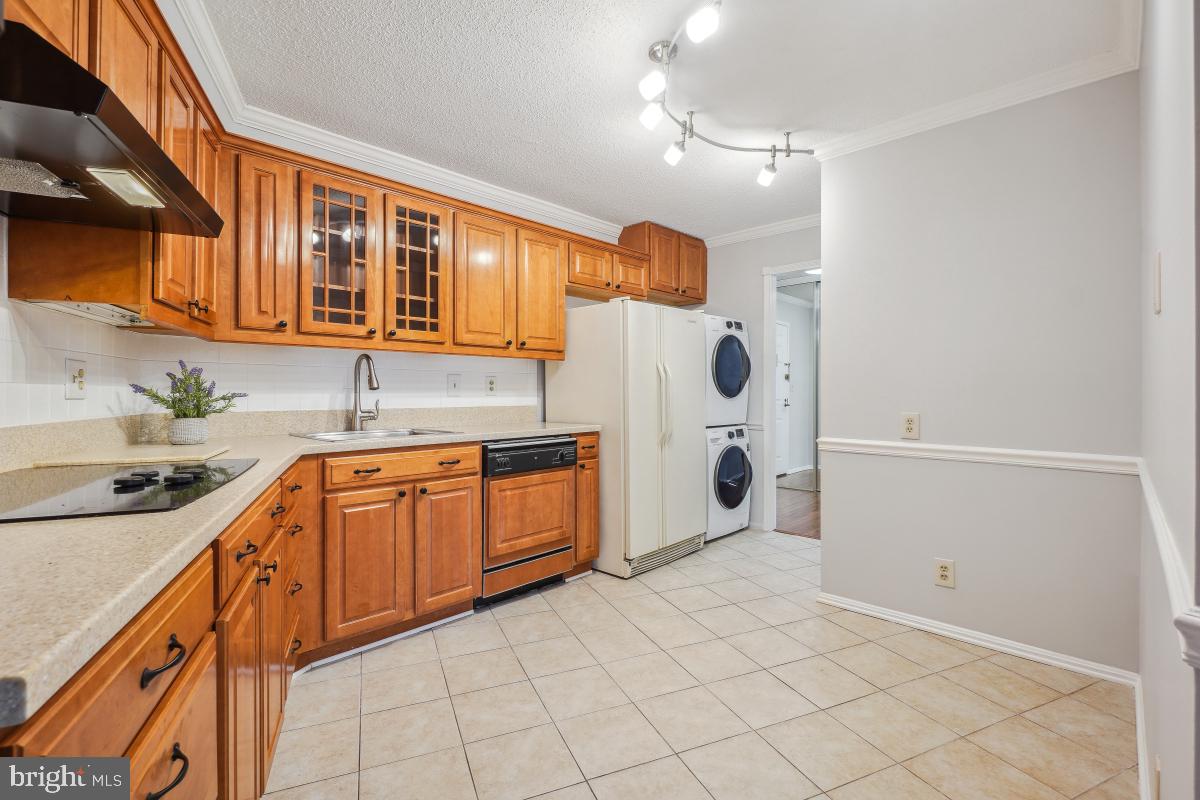 5903 Mt Eagle Drive, Unit 314 Alexandria, VA 22303 - Photo 19 of 44 a kitchen with stainless steel appliances granite countertop a sink and cabinets