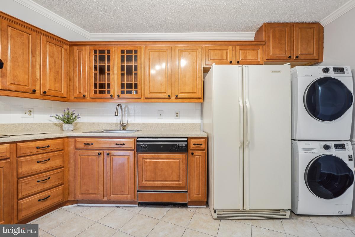 5903 Mt Eagle Drive, Unit 314 Alexandria, VA 22303 - Photo 20 of 44 a kitchen with stainless steel appliances granite countertop a refrigerator and a sink
