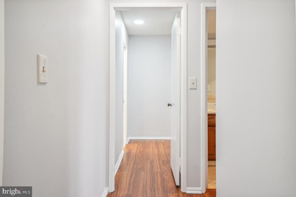 5903 Mt Eagle Drive, Unit 314 Alexandria, VA 22303 - Photo 22 of 44 a view of a hallway with wooden floor
