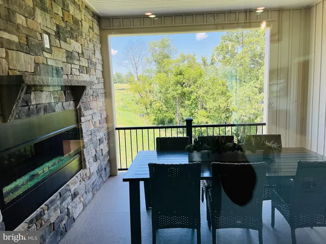 a view of a chairs and table in a balcony