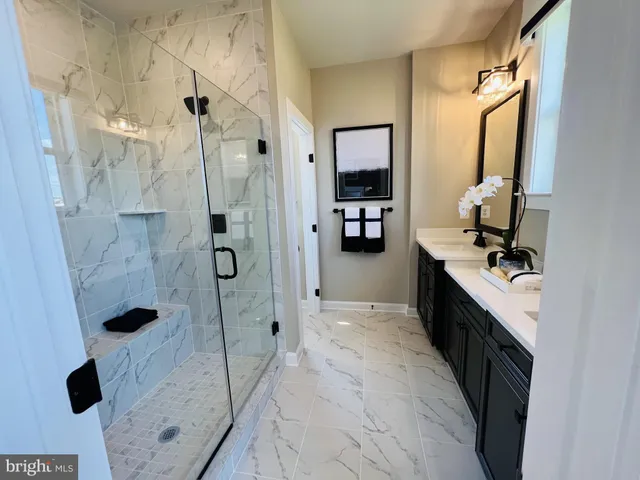 a bathroom with a sink and mirror
