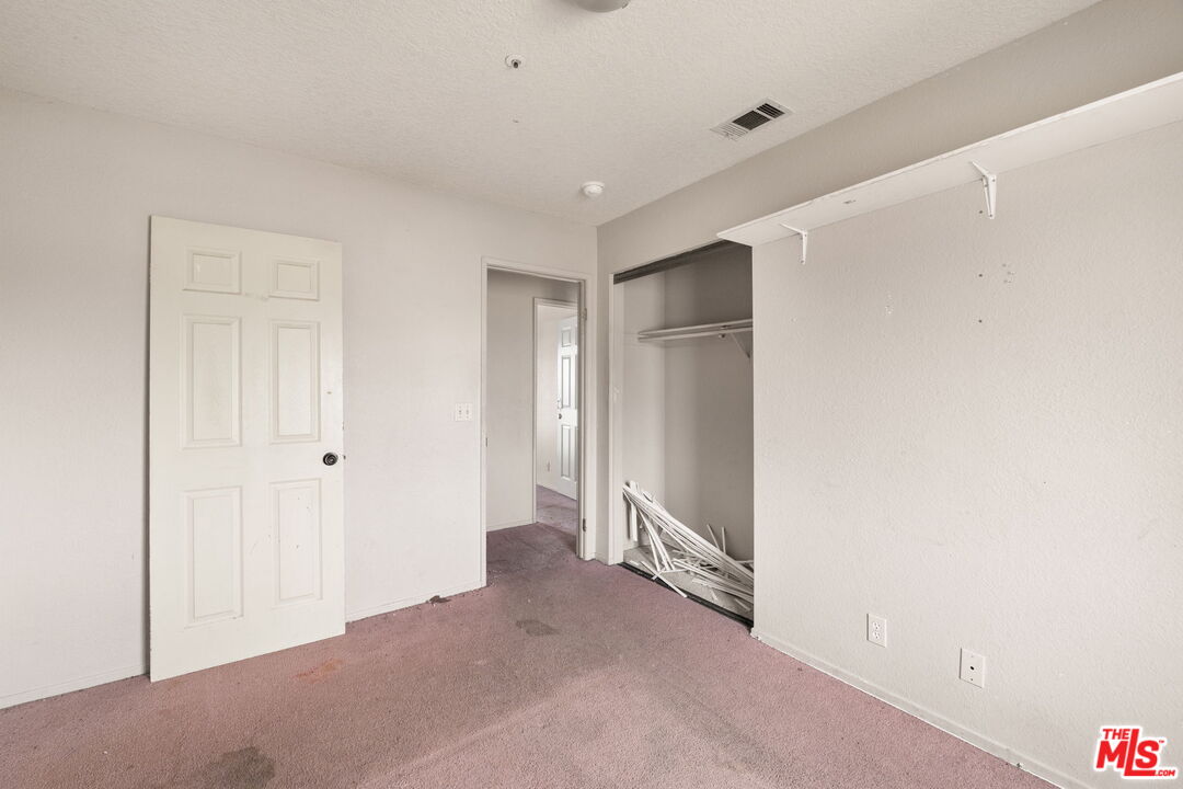 13377 Paramount Road Phelan, CA 92371 - Photo 19 of 28 a view of a big room with closet and entryway