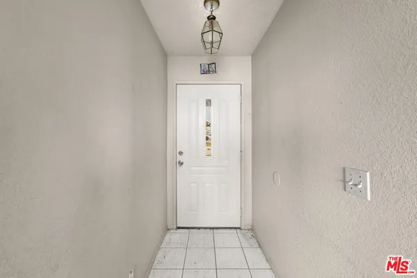 a view of a hallway to a bedroom
